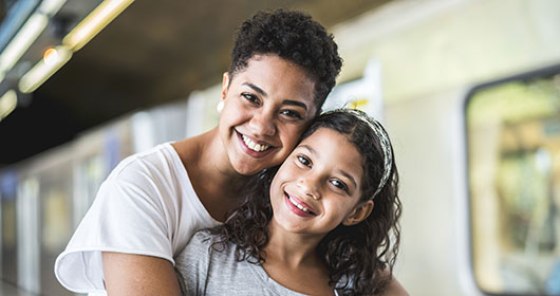 Woman embraces child