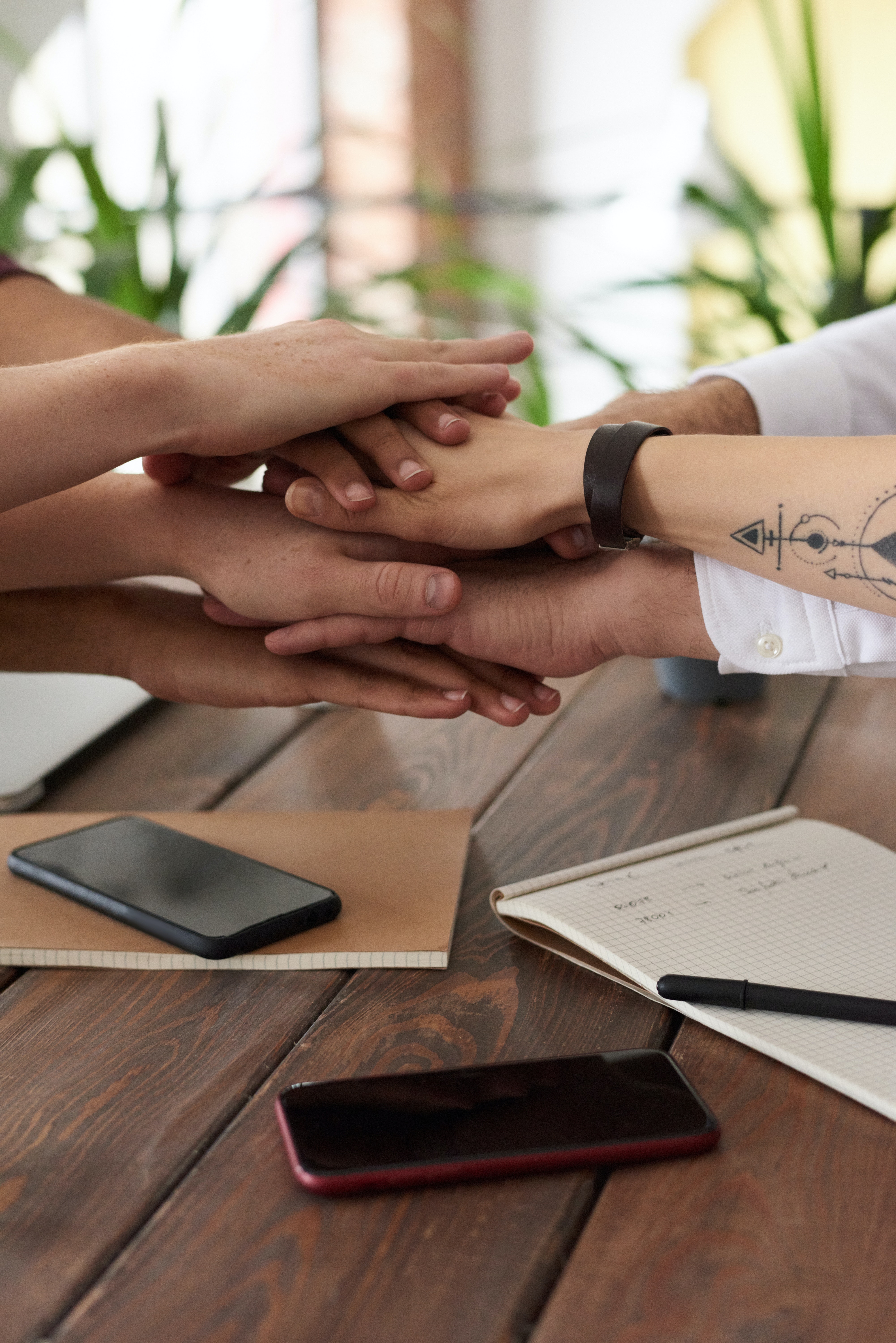 Several hands in a huddle